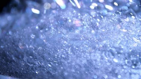 Artistic-blur-bubbles-and-dots-with-rotation-slow-motion-and-blue-color-copy-space-background