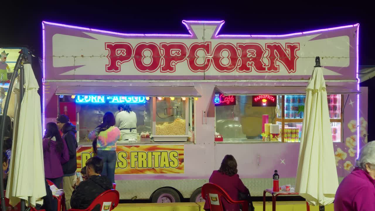 Fancy popcorn store with customers waiting in slow motion