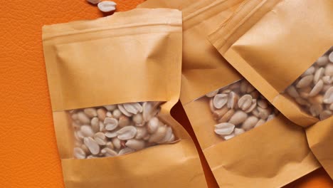 top view of peanuts in a packet on table ,