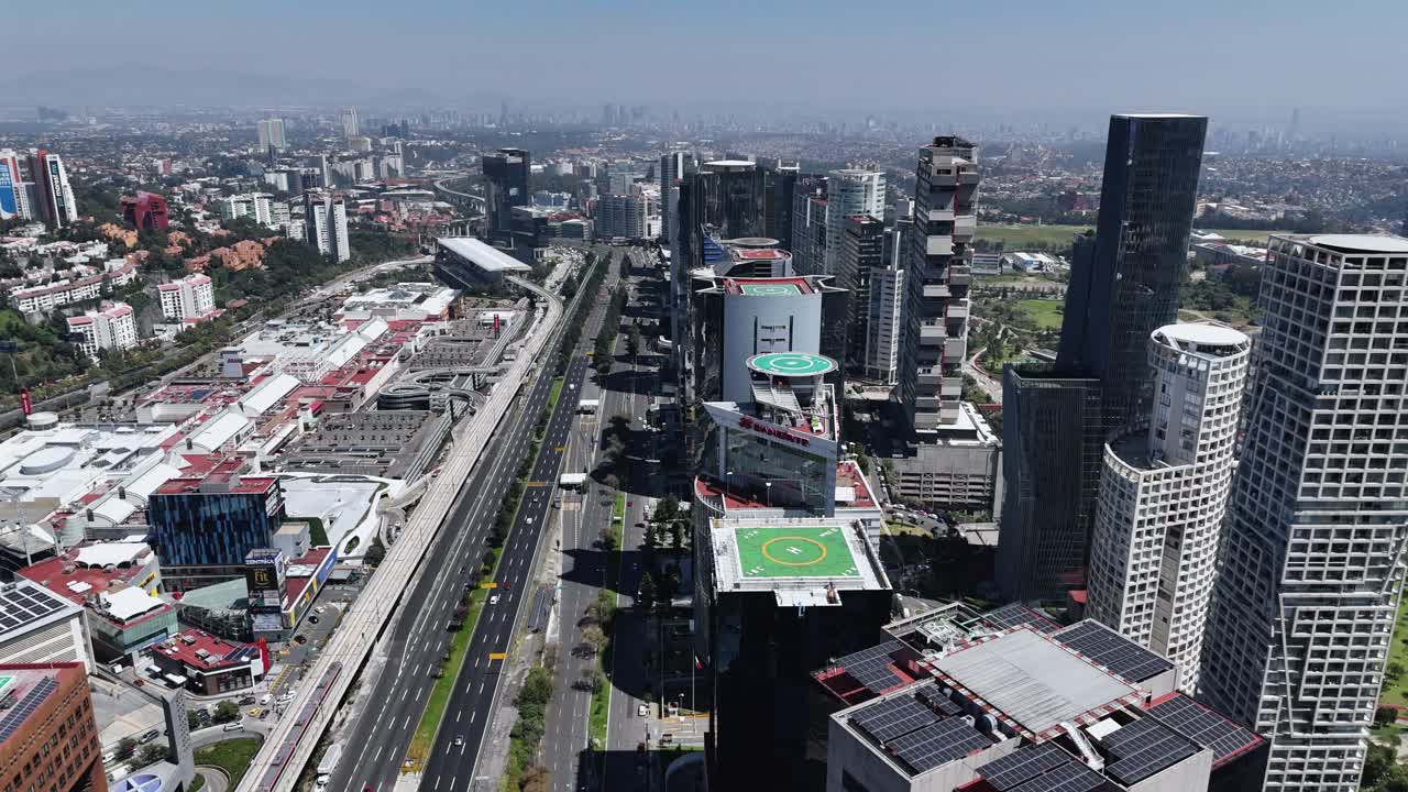 Sweeping drone views of Santa Fe's urban skyline, Mexico City
