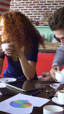 businesswomen in a coffee shop meeting
