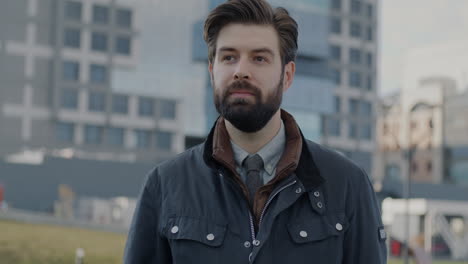 smiling man giving okay sign in city