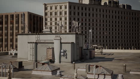 urban rooftop structures with antennas and ventilation in a downtown area