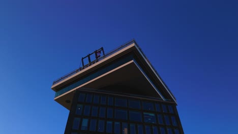 Swinging-above-the-skyline-of-Amsterdam-at-Adam-tower-romantic-sunset-aerial