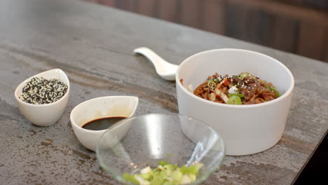 Delicious Asian noodle dish garnished with sesame seeds and green onions