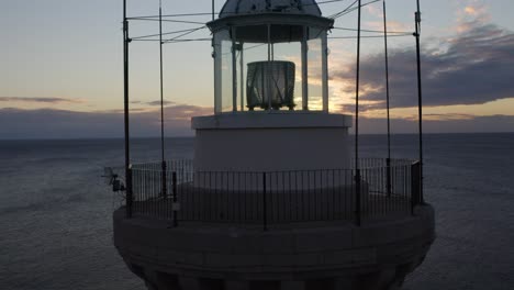 close-up drone footage. sea, island and lighthouse