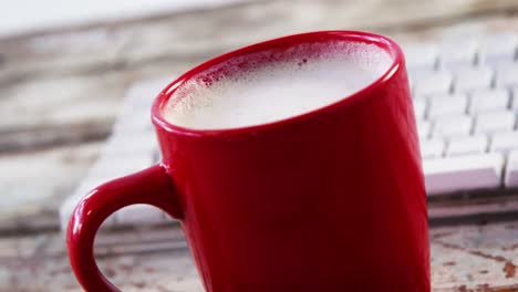 coffee cup on wooden plank