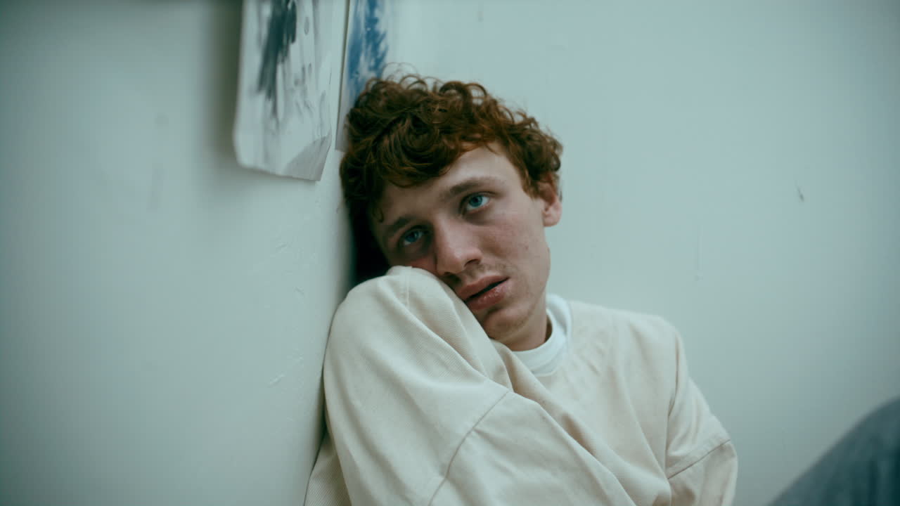 Disoriented Patient Leaning against Wall during Psychotic Episode