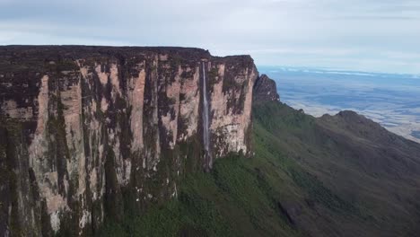 Impressive-cinematic-aerial-view-of-huge-waterfall-in-Roraima-Tepui-in-Canaima-National-Park