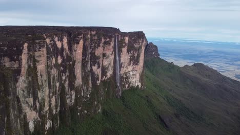 impressive cinematic aerial view of huge waterfall in roraima tepui in canaima national park