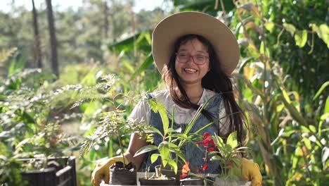 smiling girl with a basket full of avocado plants, gravel robusta