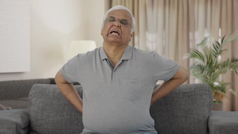 Sick-Indian-old-man-suffering-from-back-pain