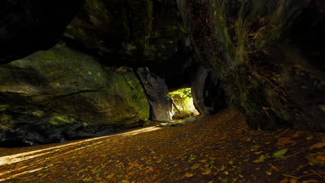 Shaft-of-light-beaming-down-into-large-cave