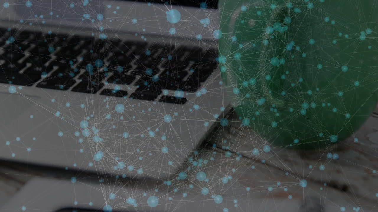 Data network flowing across silver laptop keyboard and smartphone on white-washed wooden tabletop