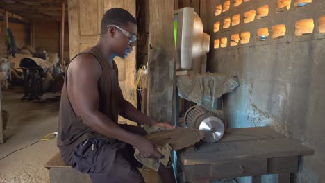 black african male heavy metal worker at background of equipment and special tools