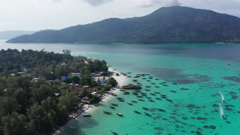 aerial of boats at koh lipe with koh adang in background, thailand