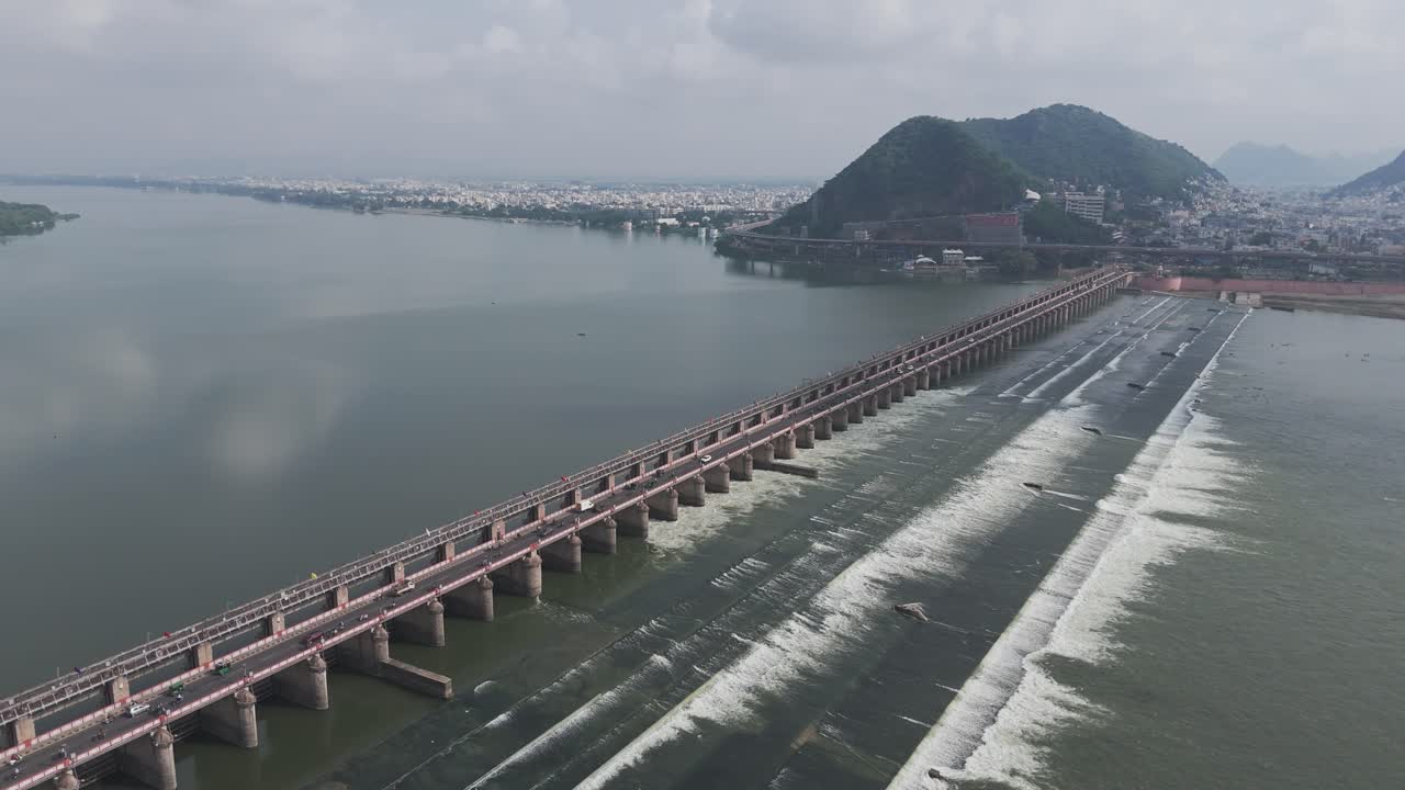 Aerial view of the Krishna River with the Prakasam Barrage crossing it.