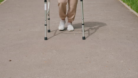 elderly person walking with walker