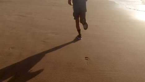 sunrise jog on beach, only feet and legs visible