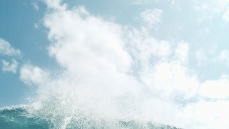gentle turquoise wave rolls toward horizon in soft slow motion midday light