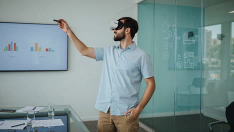 man in vr headset interacting with virtual content in a modern office
