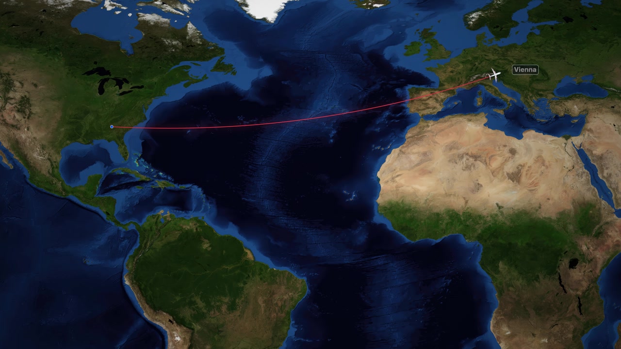 A digital world map tracks an airplane flying from Atlanta to Vienna across the Atlantic