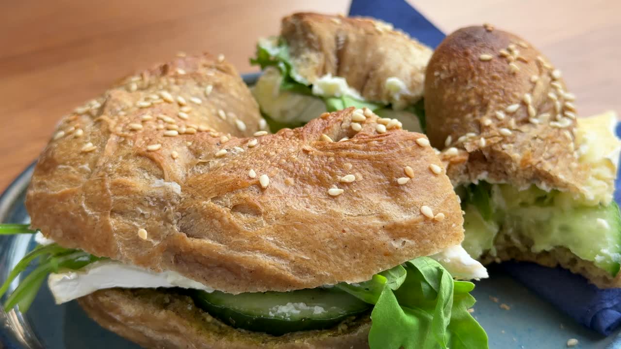 Cheese camembert bagel cut in half close up