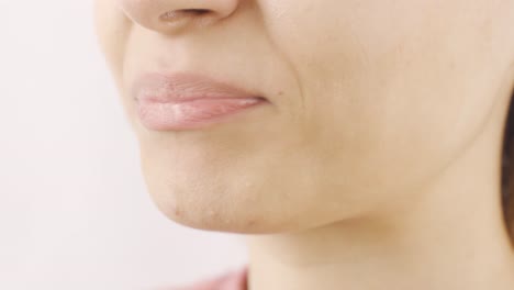 woman eating salted nuts in close-up. nuts.