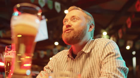 bearded man spending evening in pub