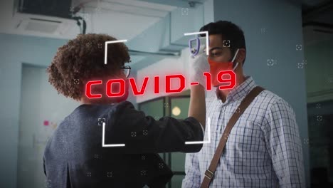 animation of covid 19 cells text over man having temperature checked in office wearing face mask