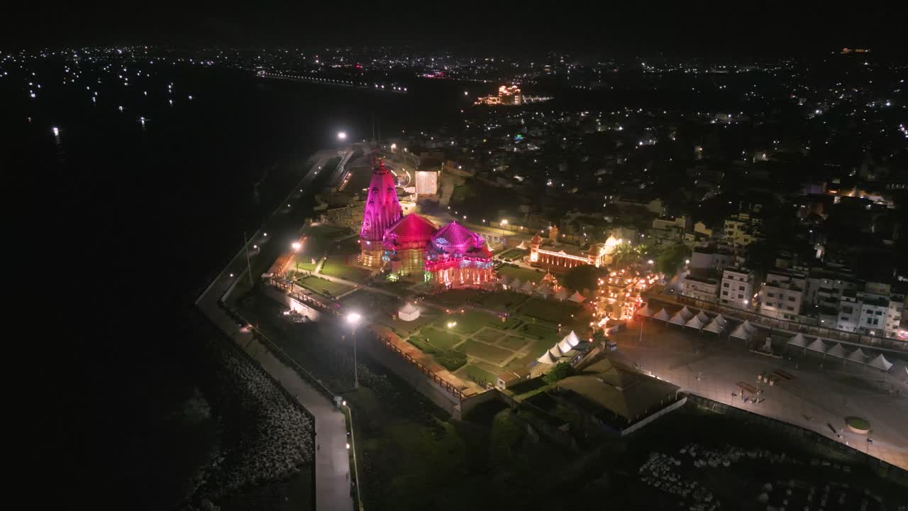 Aerial View of Illuminated Temple at Night on the Coast
