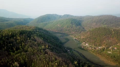 landing flight crash on the forest in sunset time plane in agriculture road farm land tourism activity in outdoor in nature local people life river side green hills and wide view landscape of mountain