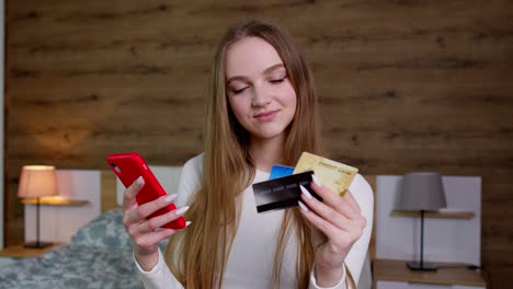 Girl-pays-for-purchases-shopping-in-web-during-sale-discounts,-ordering-food-with-debit-plastic-card