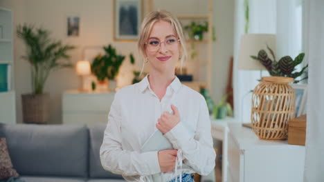 Smiling-Happy-Businesswoman-Looks-at-Camera