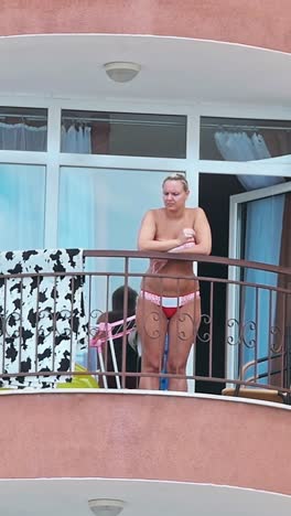 woman standing on balcony