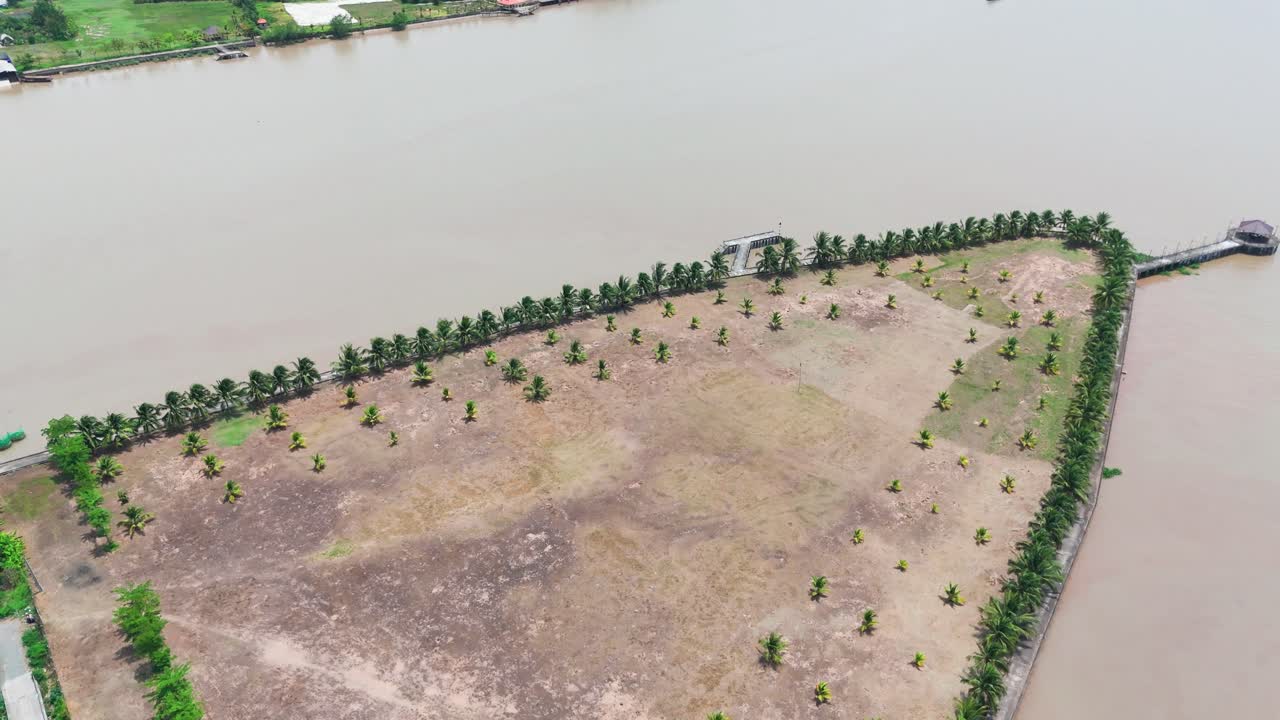 Aerial View Tilt of the Road, the Farm, and the River in Ben Tre.