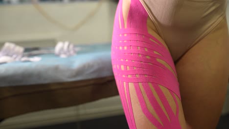 kinesiology tape application on thigh