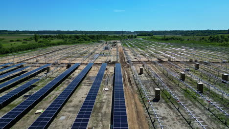 installation of solar panels in a clean energy park. aerial at daytime