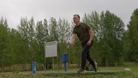 disc golfer throws a forehand throw and celebrates success