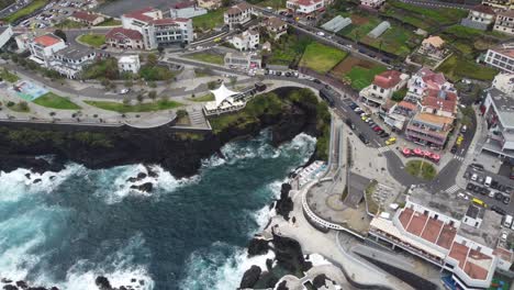 looking down at porto moniz during strong winds on the seafront