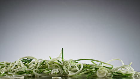 sliced cucumber falling in slow motion