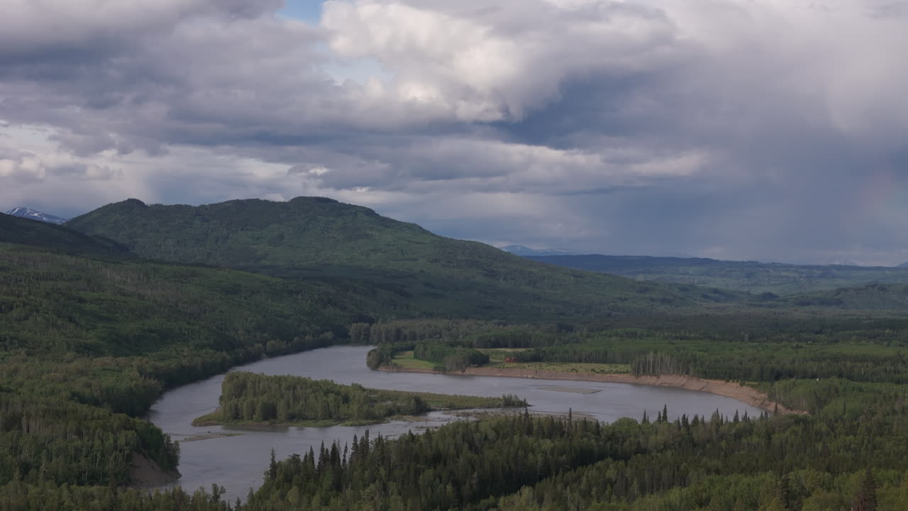 A winding river cuts through Yukon’s dense forests