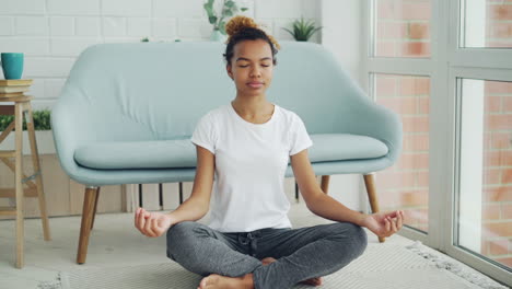 woman meditating at home
