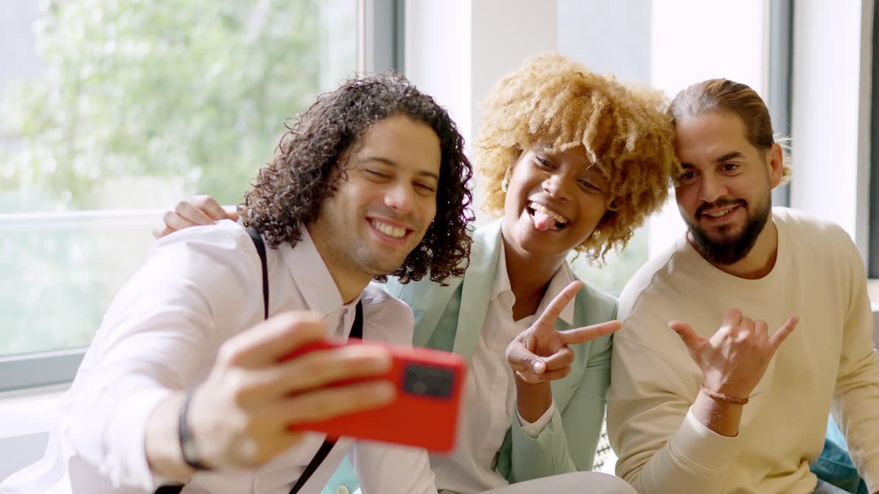 Coworkers taking a selfie during a work break