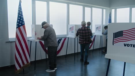 people voting in a polling station