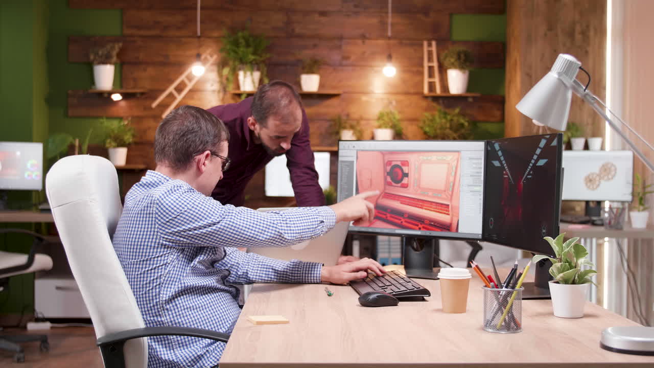 Office workspace with two men collaborating on a project