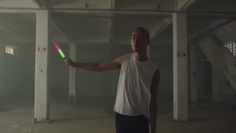 fashionable young man in an abandoned warehouse