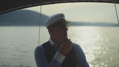 captain smoking a pipe at sea