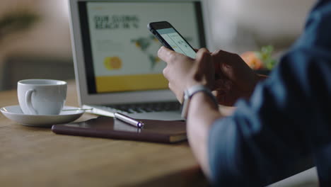 close-up-businessman-hands-using-smartphone-in-cafe-reading-digital-document-browsing-email-messages-networking-online-working-on-mobile-phone-technology