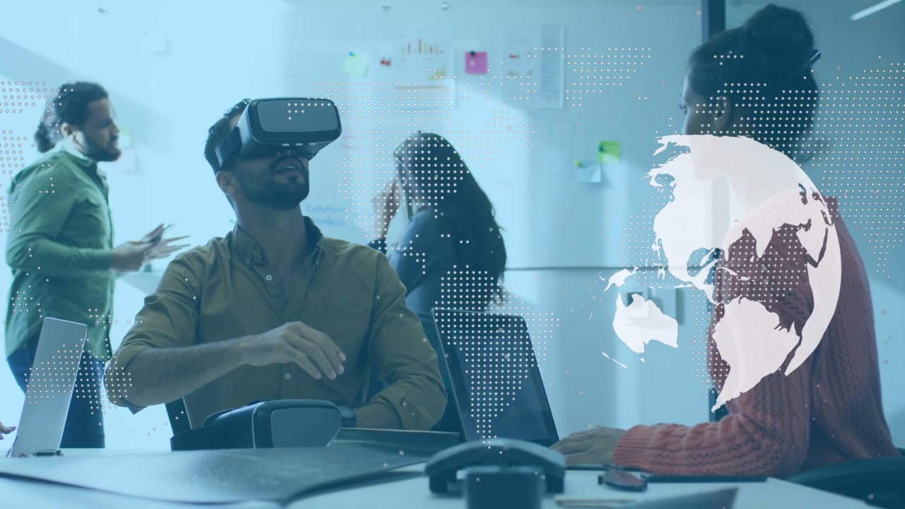 Man wearing VR headset raising hand, swiping globe overlay while team guiding product demo